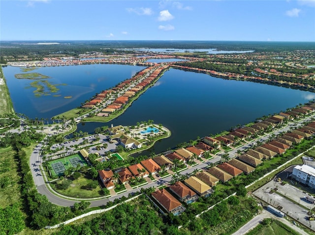 birds eye view of property with a water view