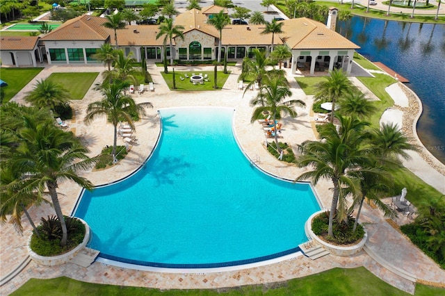 view of swimming pool featuring a water view