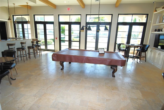 game room with french doors, billiards, and beam ceiling