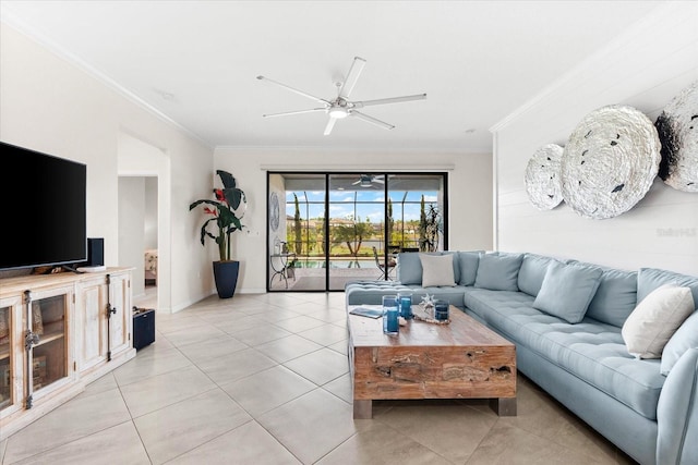 living room featuring ceiling fan, light tile patterned floors, and crown molding