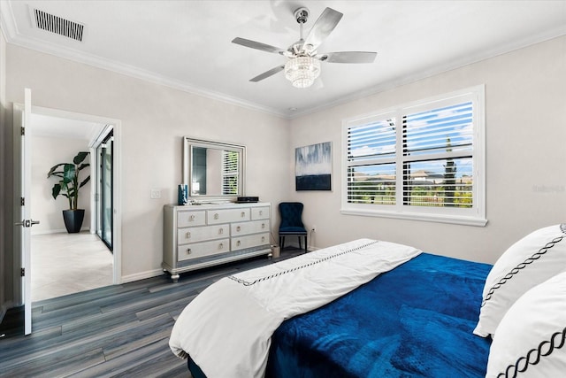 bedroom featuring ceiling fan, crown molding, and dark hardwood / wood-style floors