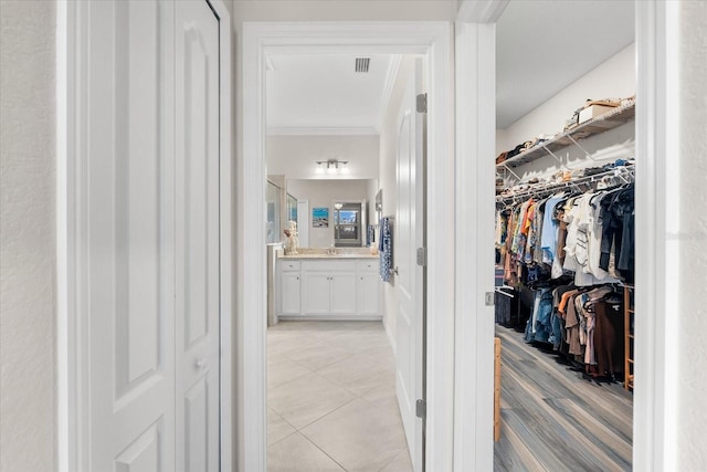 spacious closet with light tile patterned flooring