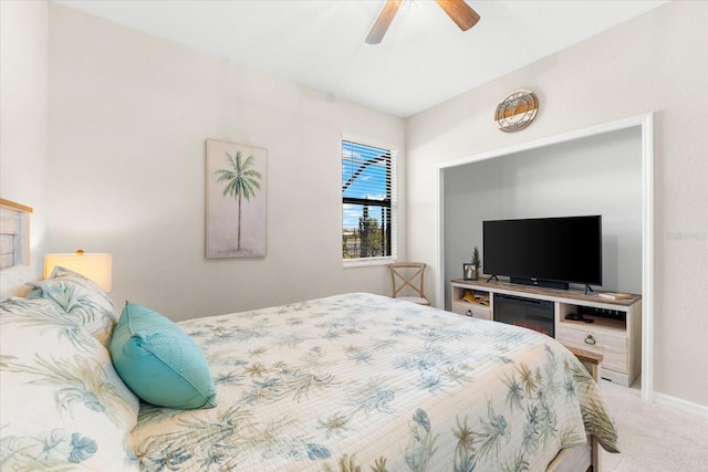 bedroom featuring ceiling fan and carpet floors