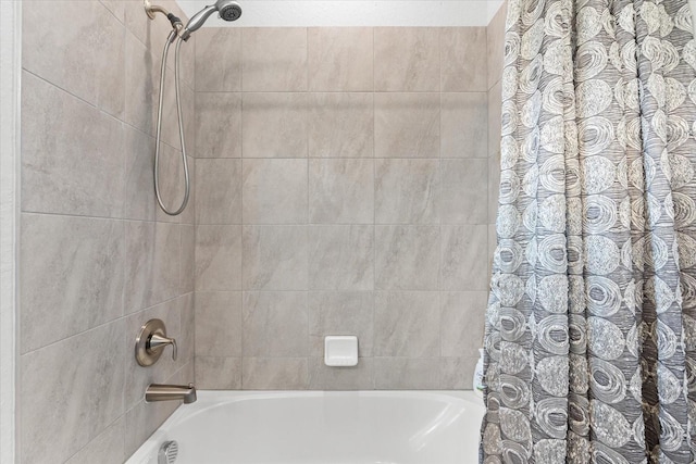 bathroom with shower / tub combo