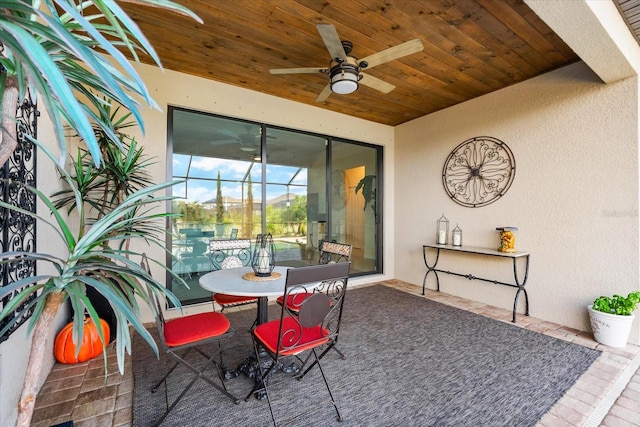 interior space with ceiling fan and a lanai