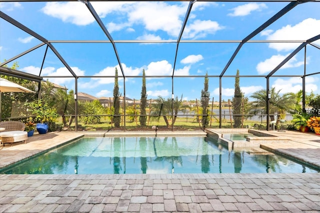 view of swimming pool featuring an in ground hot tub, glass enclosure, and a patio area