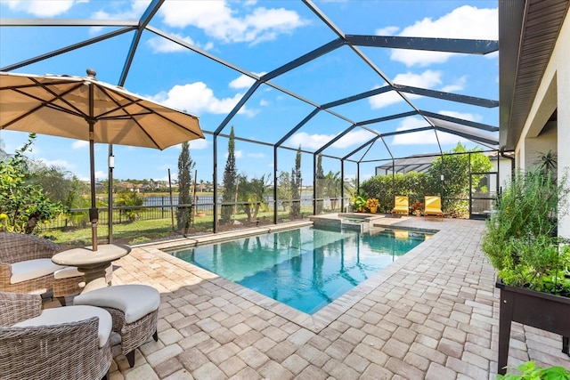 view of swimming pool featuring an in ground hot tub, a patio, and glass enclosure