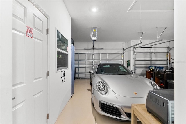 garage featuring a garage door opener