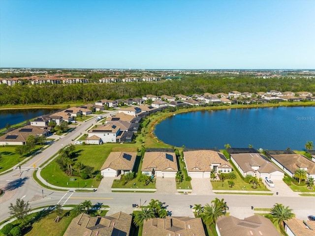 birds eye view of property with a water view