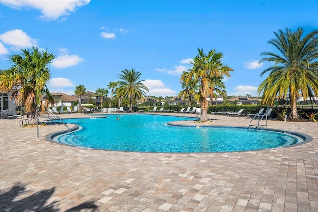 view of swimming pool with a patio