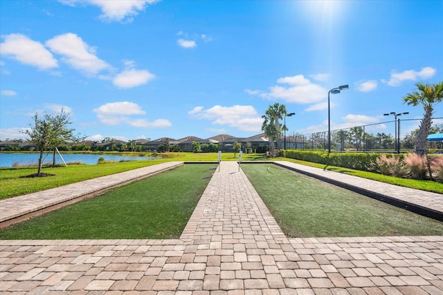 surrounding community featuring a water view