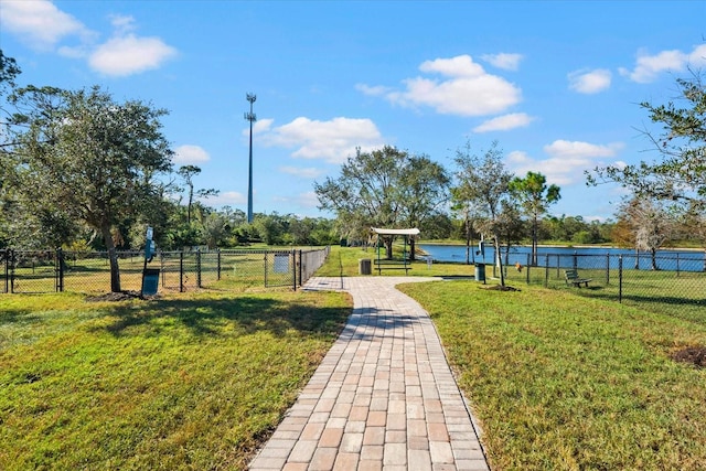 view of community featuring a yard and a water view