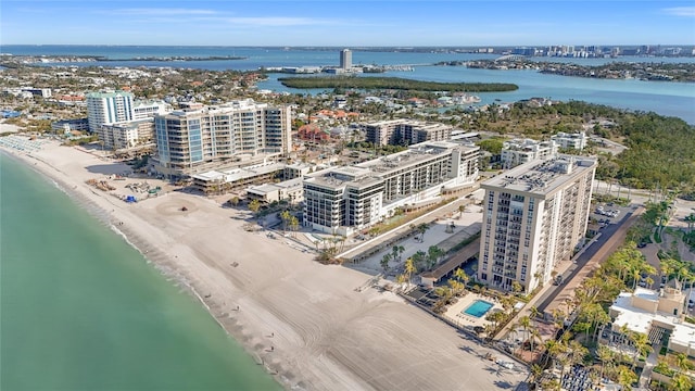 aerial view featuring a beach view, a view of city, and a water view