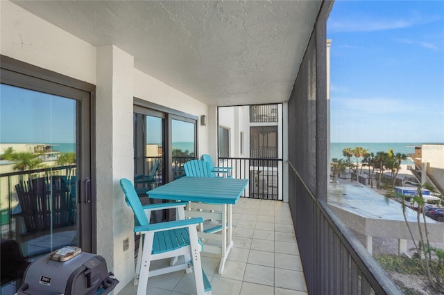 balcony featuring a water view