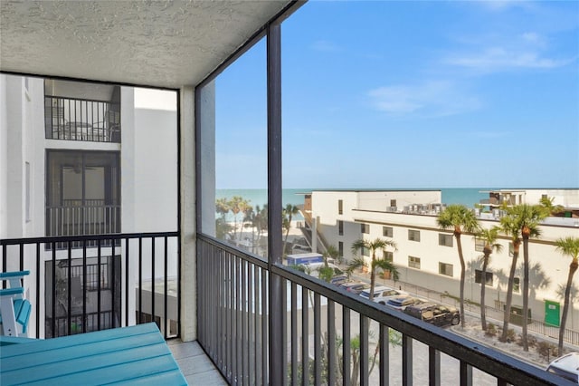 balcony featuring a water view