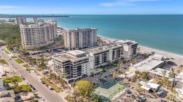 birds eye view of property featuring a city view and a water view