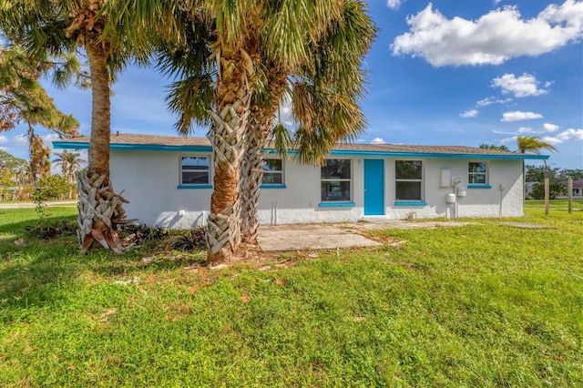 view of front of home with a front lawn