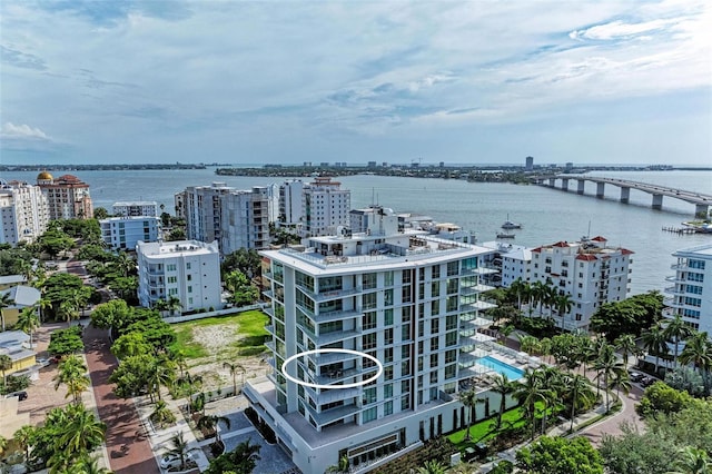 birds eye view of property with a water view