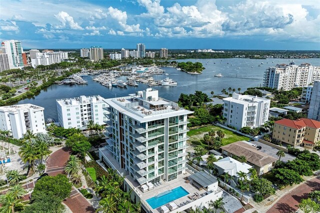 111 Golden Gate Pt Unit 402, Sarasota, FL 34236 - view of urban area with a large body of water, a pool, and apartment complex / building