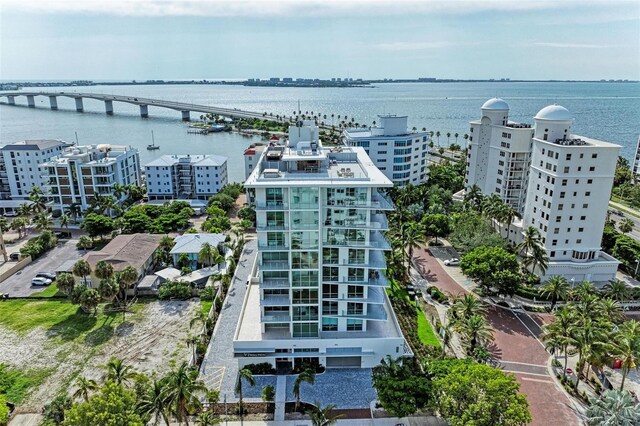 111 Golden Gate Pt Unit 402, Sarasota, FL 34236 - drone / aerial view of apartment complex / building, a notable bridge, and a large body of water