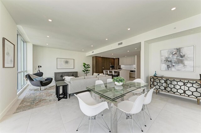 111 Golden Gate Pt Unit 402, Sarasota, FL 34236 - dining space with recessed lighting and light tile patterned floors