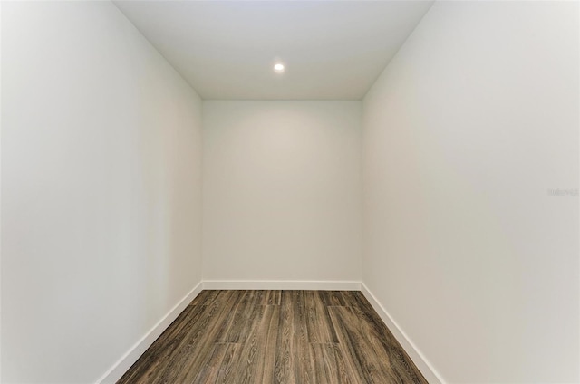 interior space with dark wood-style floors, baseboards, and recessed lighting