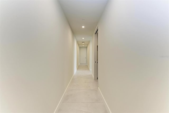 111 Golden Gate Pt Unit 402, Sarasota, FL 34236 - hallway featuring recessed lighting and baseboards