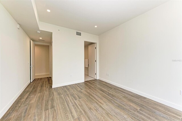 111 Golden Gate Pt Unit 402, Sarasota, FL 34236 - unfurnished bedroom featuring wood finished floors, baseboards, and recessed lighting