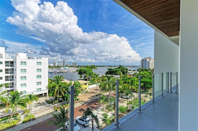 balcony featuring a view of city and a water view