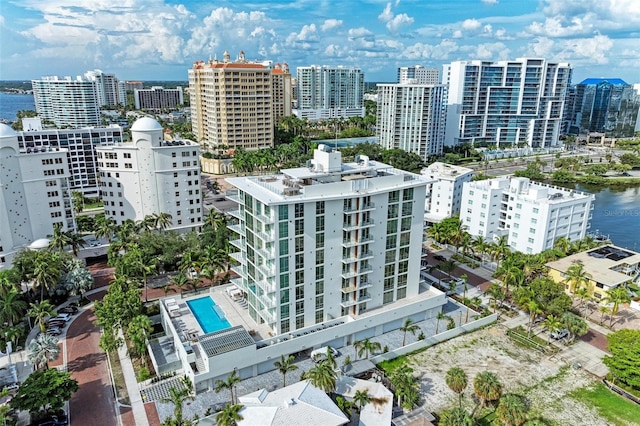 birds eye view of property featuring a city view and a water view