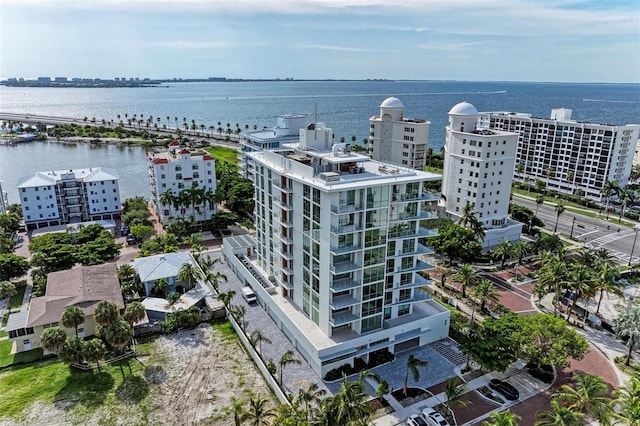 birds eye view of property featuring a view of city and a water view