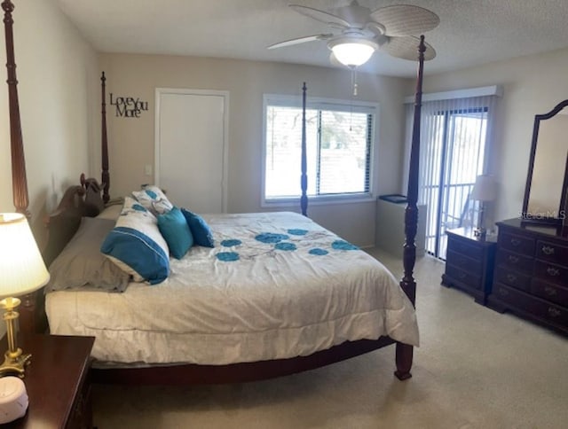 bedroom with ceiling fan and carpet floors