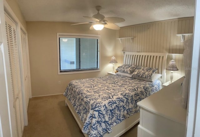 carpeted bedroom with a closet and ceiling fan