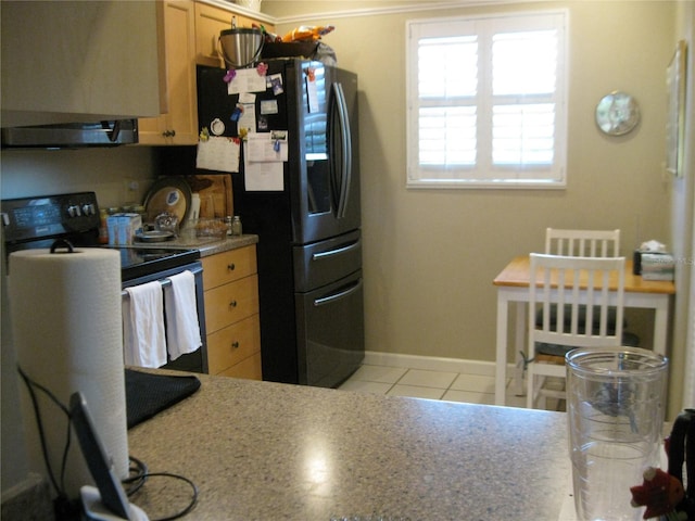 kitchen featuring stainless steel refrigerator with ice dispenser, white electric range, light brown cabinetry, and light tile patterned flooring