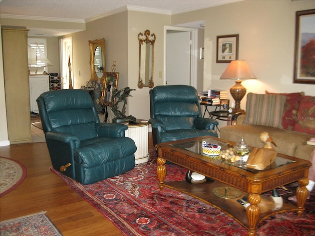 living room featuring wood-type flooring and crown molding