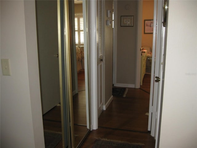 hall with dark hardwood / wood-style floors