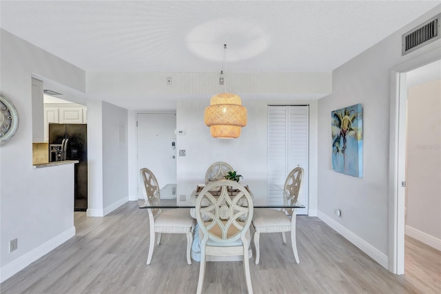 dining room featuring light wood-type flooring