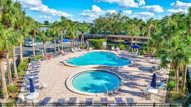 view of swimming pool featuring a patio area