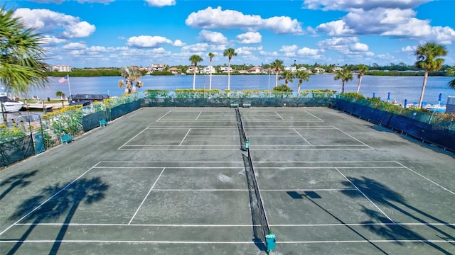 view of sport court featuring a water view