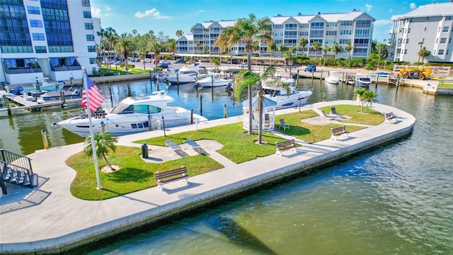 dock area with a water view and a yard