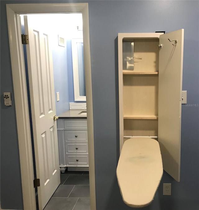 bathroom featuring tile patterned floors and vanity