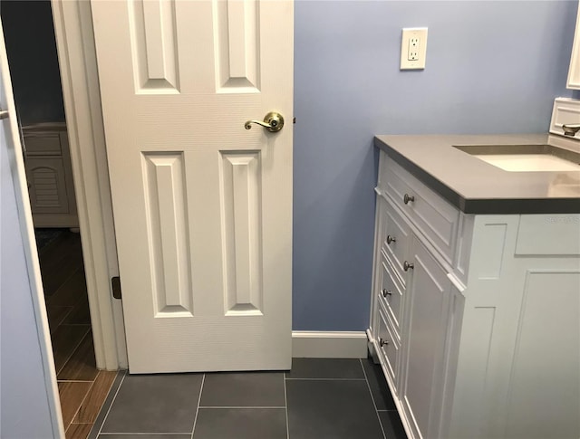1446 56th St W Unit 1446, Bradenton, FL 34209 - bathroom with vanity, tile patterned floors, and baseboards