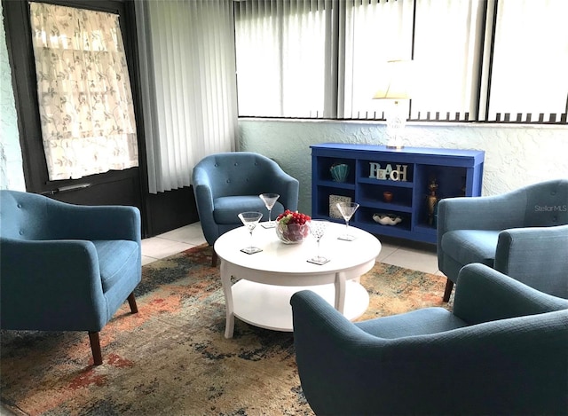 living area featuring tile patterned floors