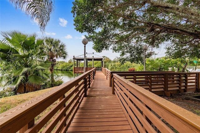 surrounding community featuring a gazebo and a water view