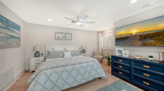 bedroom with ceiling fan and light hardwood / wood-style floors