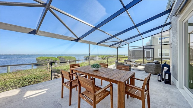 view of patio / terrace with outdoor lounge area, a water view, and a lanai