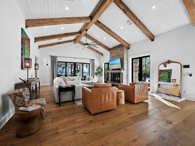 living room with ceiling fan, hardwood / wood-style floors, high vaulted ceiling, and french doors