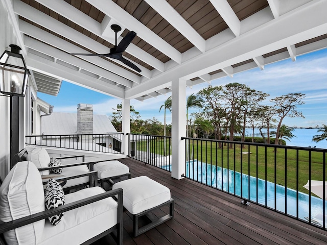 deck with ceiling fan and a yard