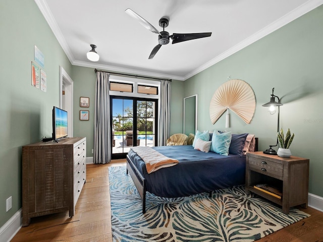 bedroom featuring french doors, light hardwood / wood-style flooring, ceiling fan, access to exterior, and ornamental molding