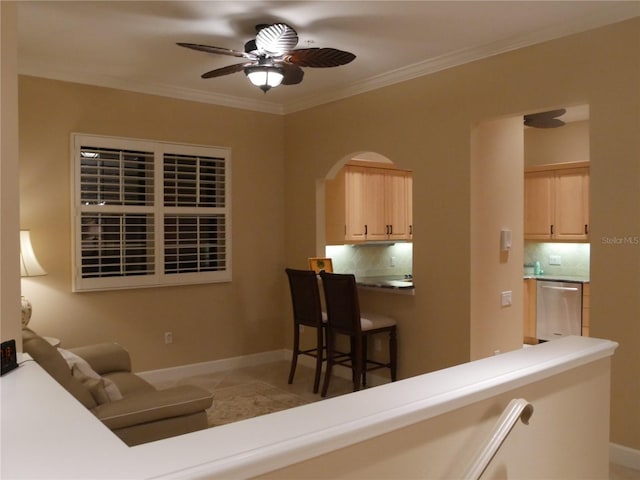 living room featuring ceiling fan and ornamental molding